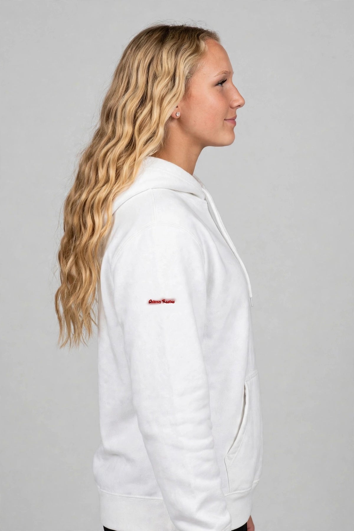 Harper wearing the Hangry Harper Shakopee Hoodie – White, left sleeve view
