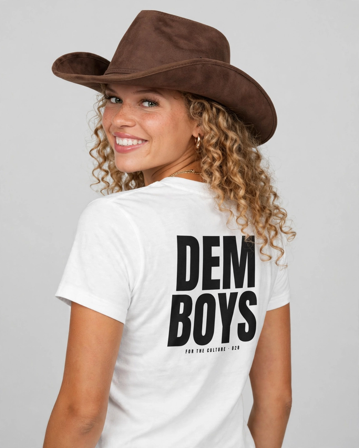 Amara wearing the DEM BOYS Tee – BCG Royal (White), back view
