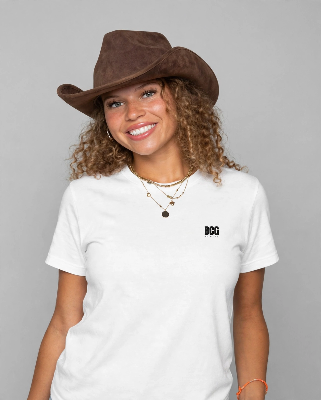 Amara wearing the DEM BOYS Tee – BCG Royal (White), front view