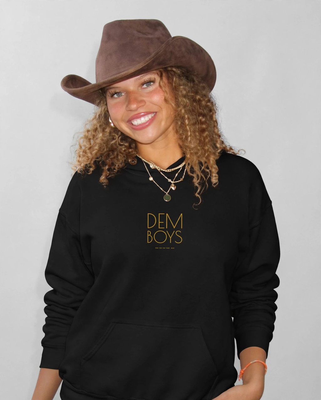 Amara wearing the DEM BOYS Hoodie – Poiret (Black), front view