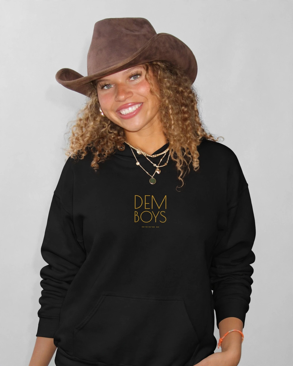 Amara wearing the DEM BOYS Hoodie – Poiret (Black), front view