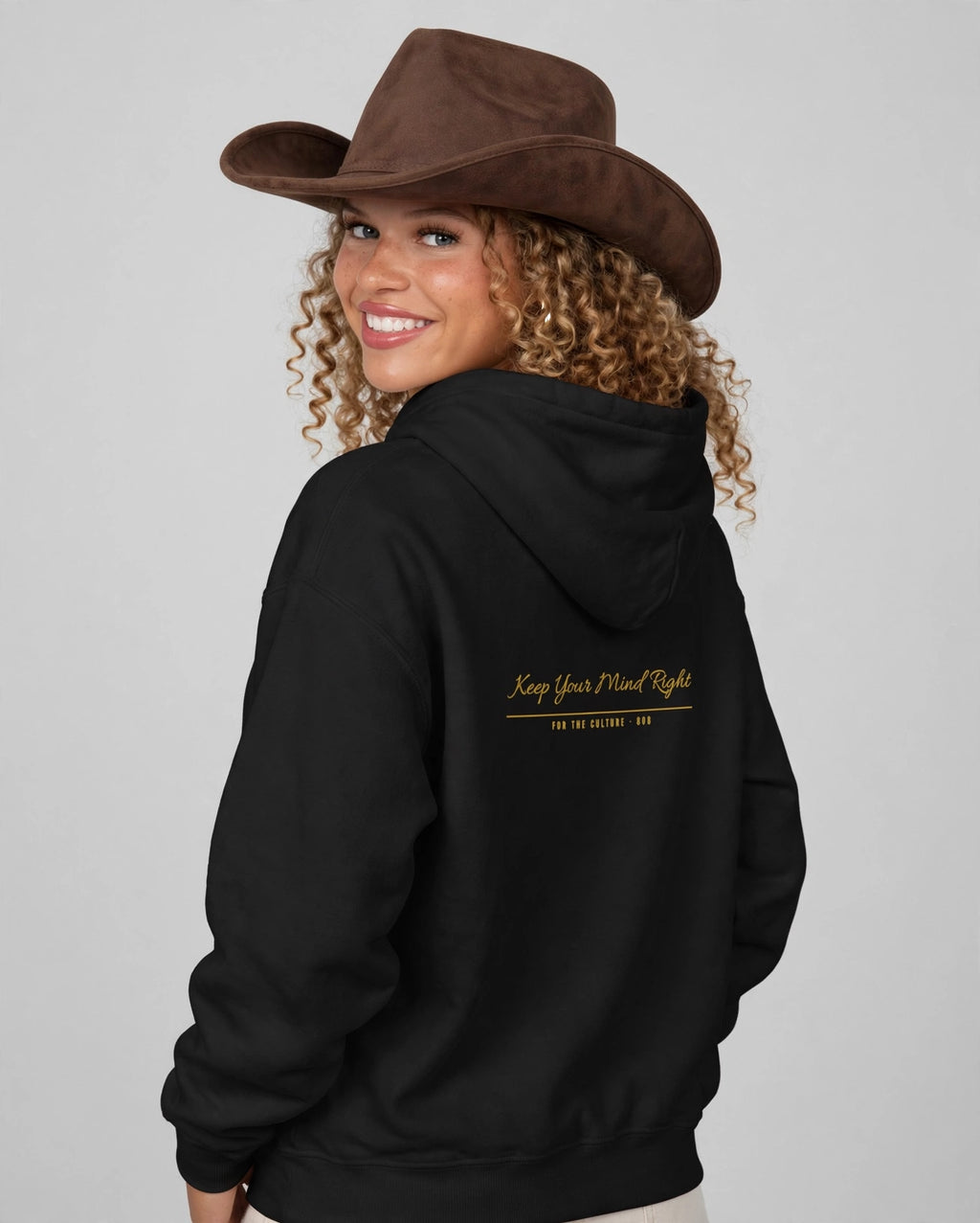 Amara wearing the Keep Your Mind Right Hoodie – Allura (Black), back view