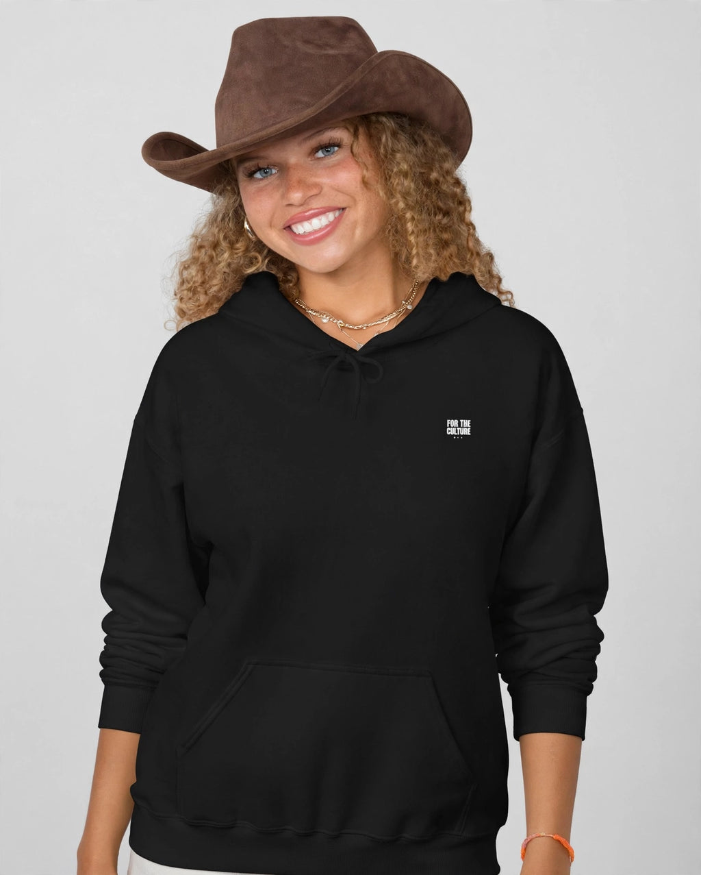 Amara wearing the Family First Hoodie – Fugaz (Black), front view