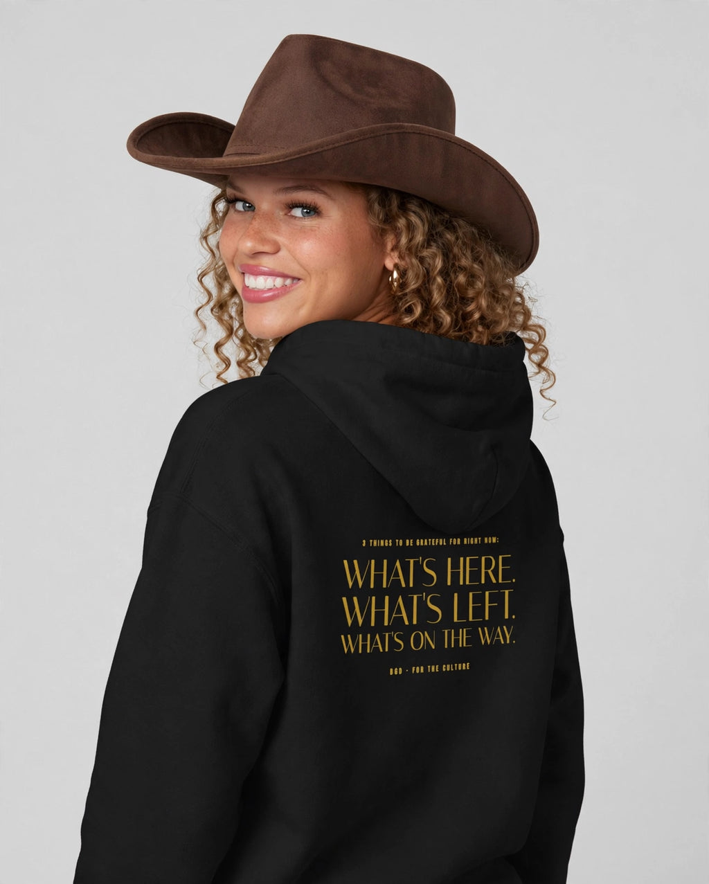 Amara wearing the Grateful Hoodie – Italiana (Black), back view