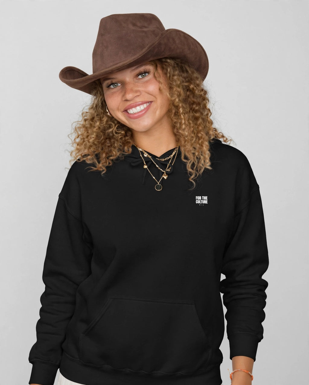 Amara wearing the The Lesson Hoodie – Blackletter (Black), front view