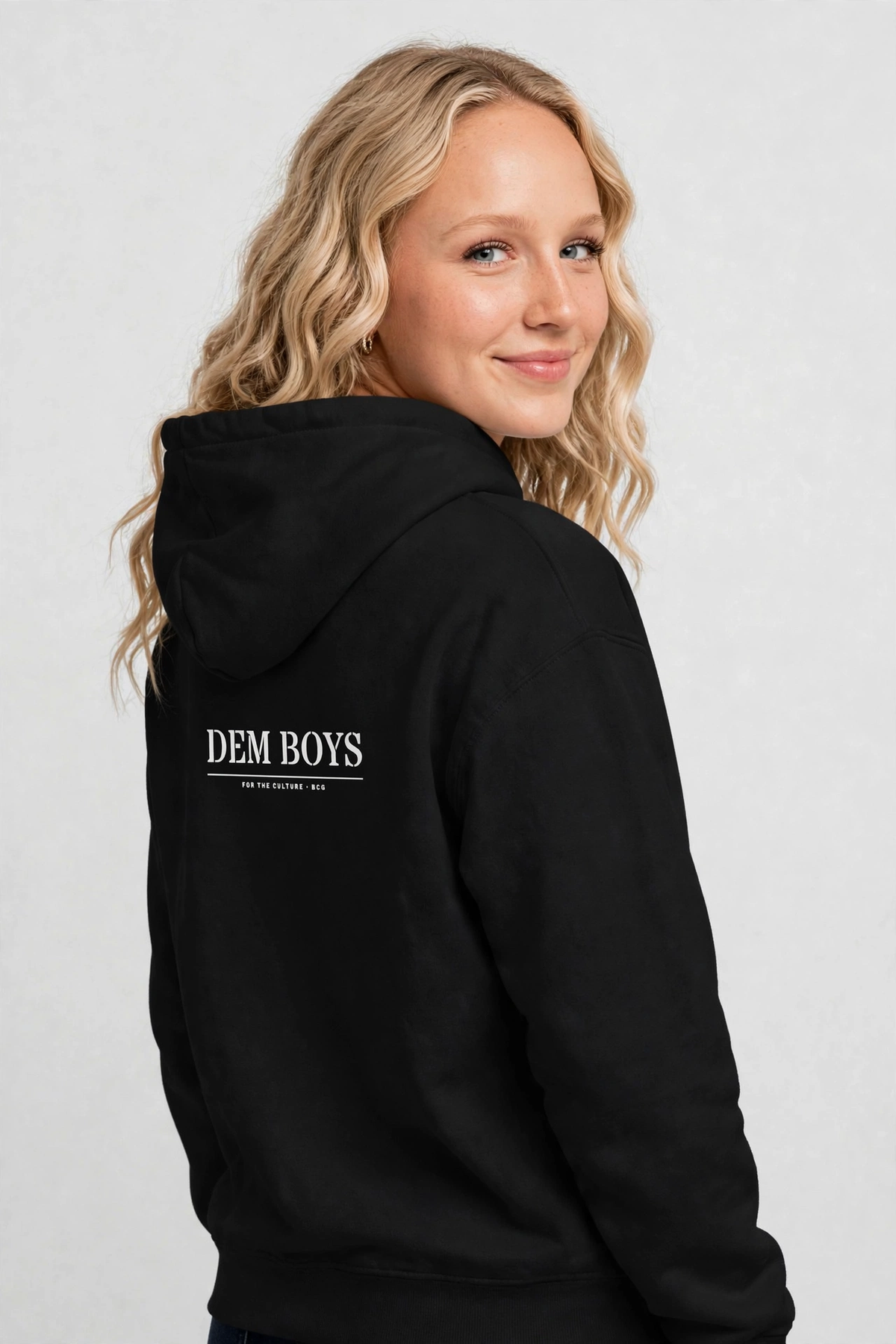Harper wearing the DEM BOYS Hoodie – Stencil (Black), back view