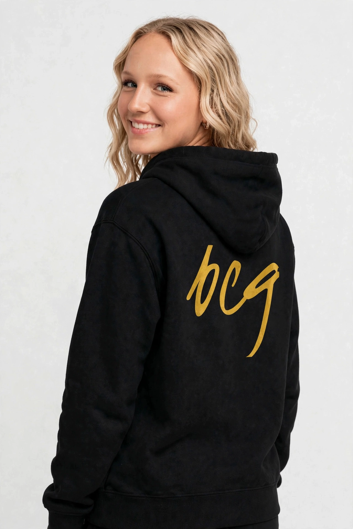 Harper wearing the BCG Nightclub Brush Signature Hoodie - Black, back view