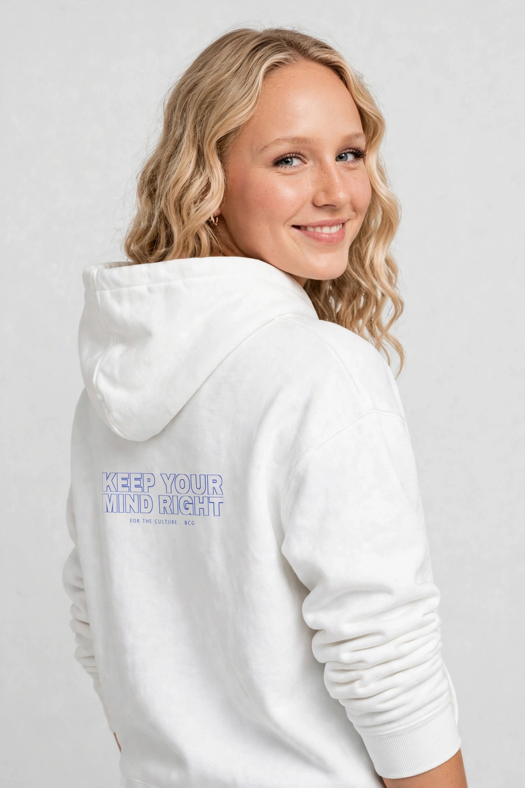 Harper wearing the Keep Your Mind Right Hoodie – Varsity (White), back view