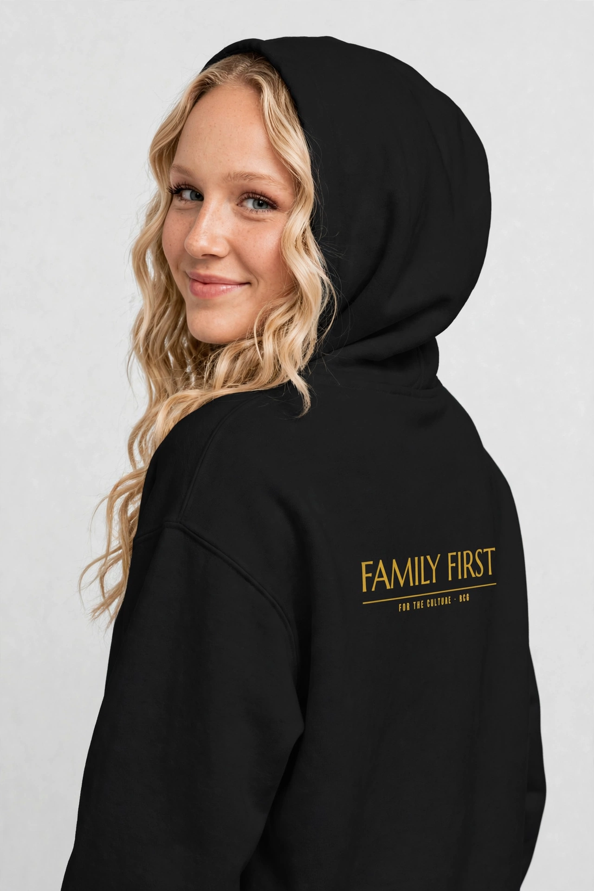 Harper wearing the Family First Hoodie – Marcellus (Black), back view