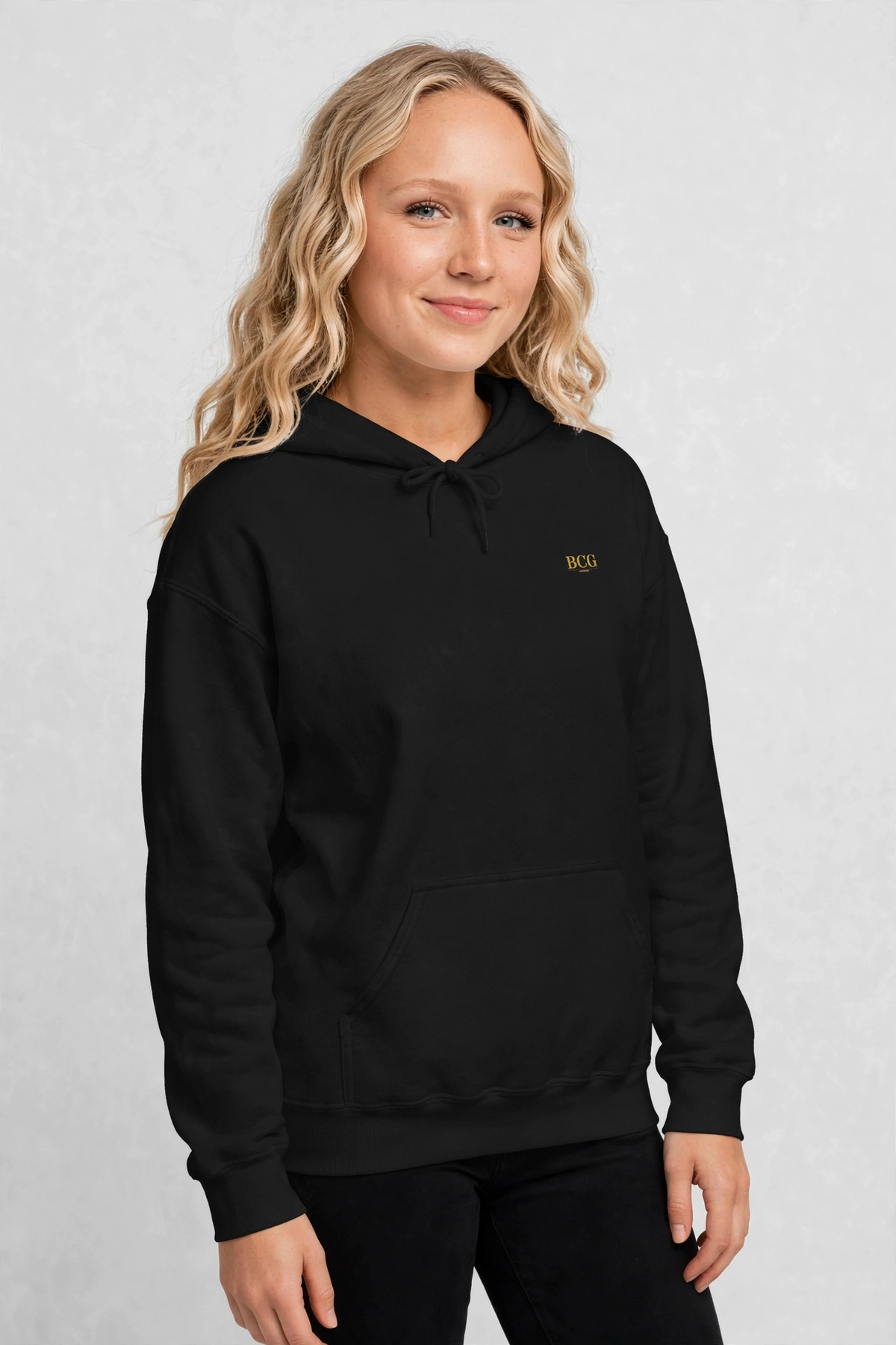 Harper wearing the Grateful Hoodie – Limelight (Black), front view