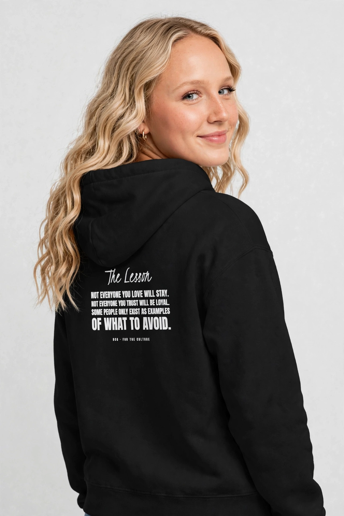 Harper wearing the The Lesson Hoodie – Kristi (Black), back view