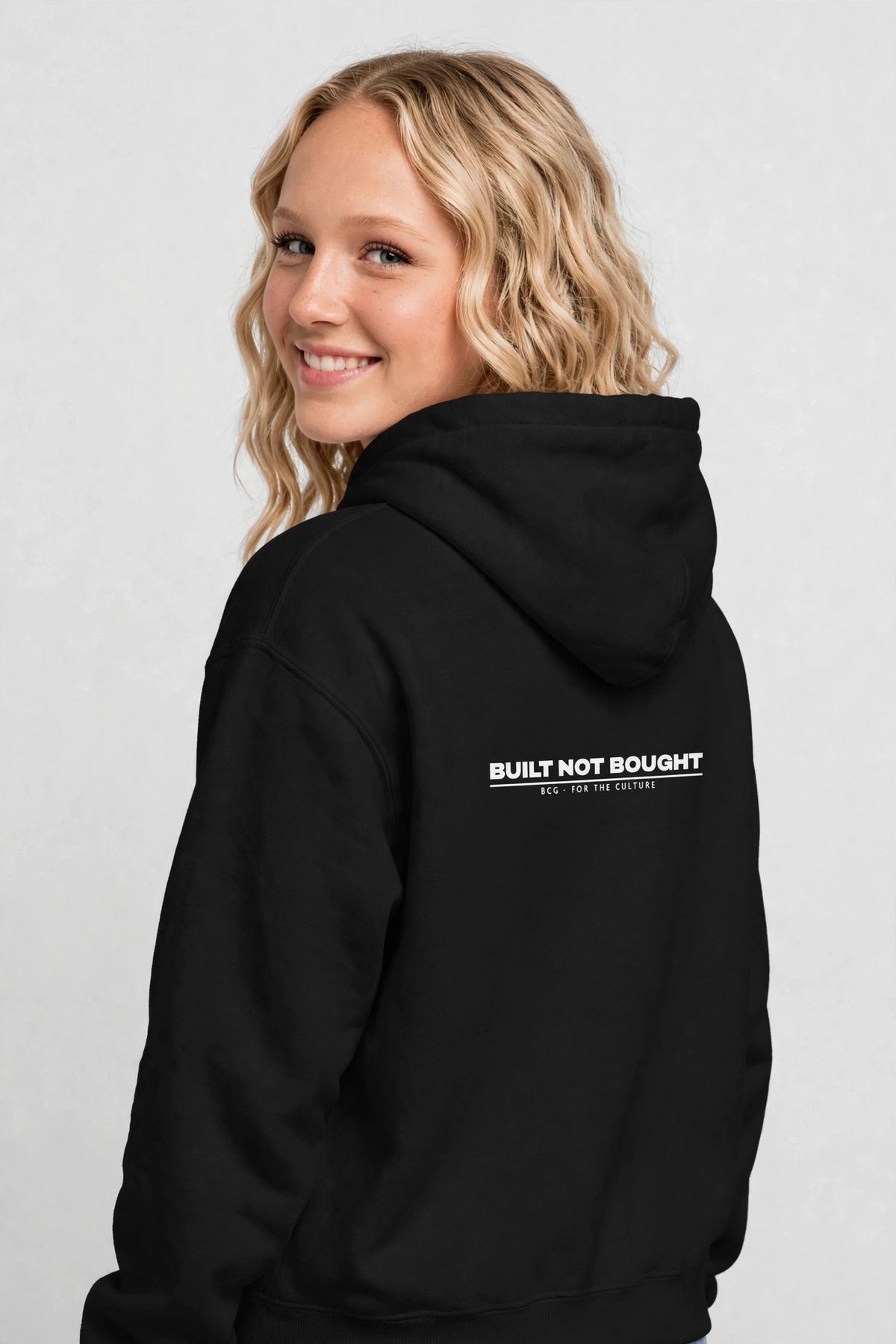 Harper wearing the Built Not Bought Hoodie – Archivo (Black), back view