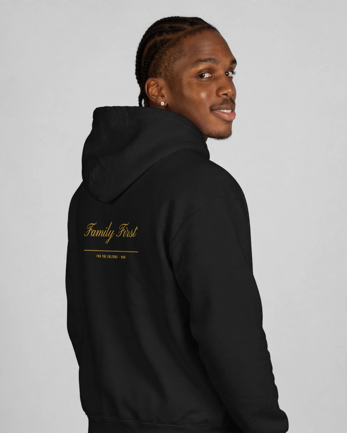 Patrick wearing the Family First Hoodie – Pinyon (Black), back view