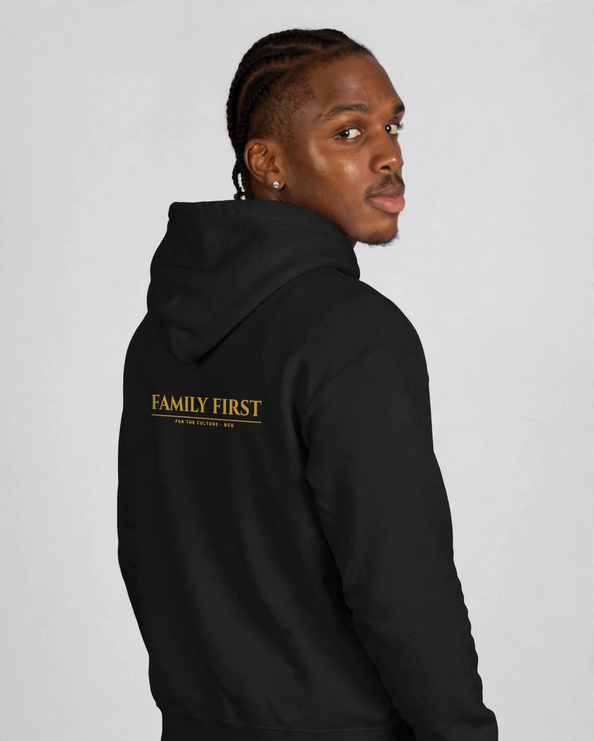 Patrick wearing the Family First Hoodie – Cinzel (Black), back view