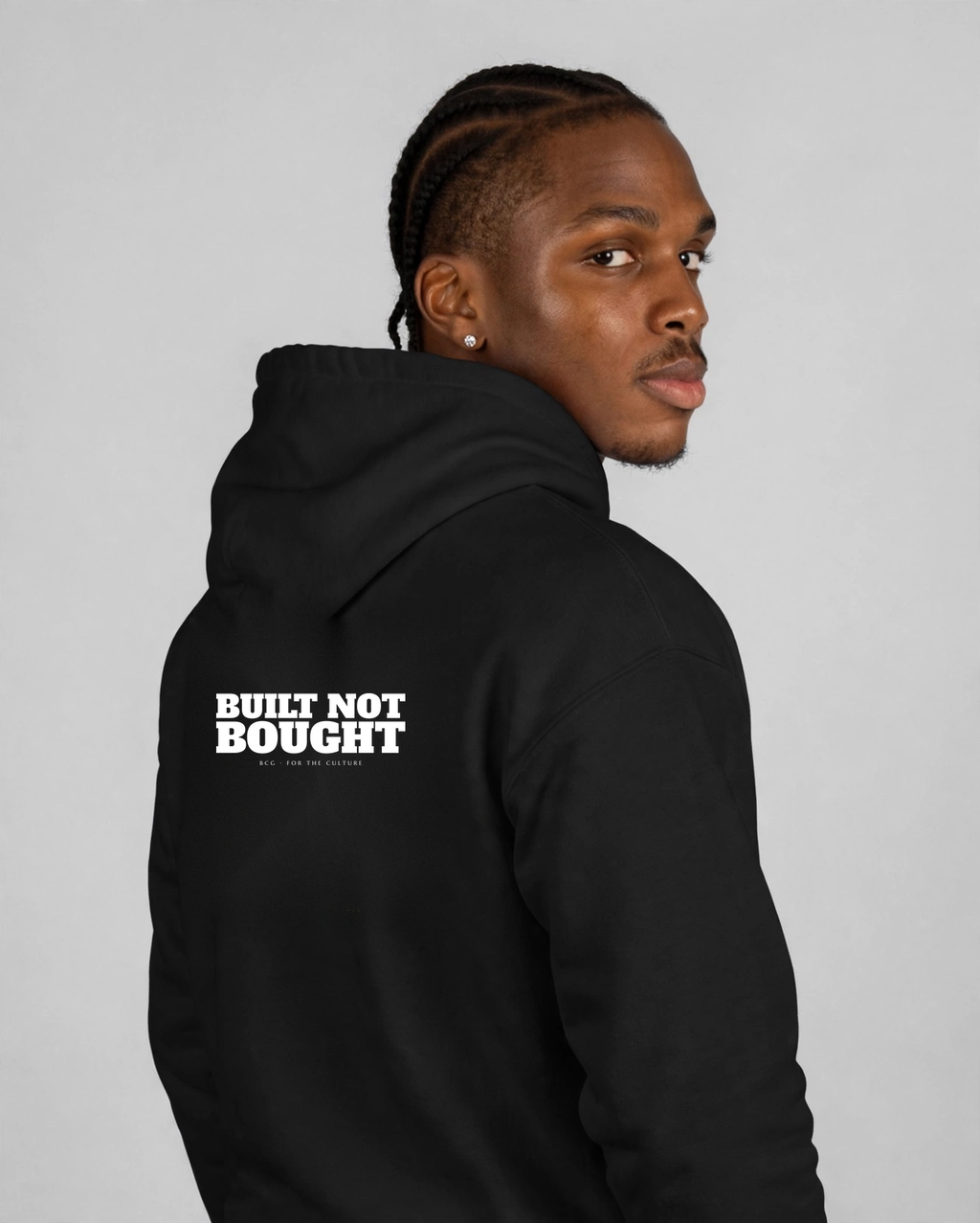 Patrick wearing the Built Not Bought Hoodie – Alfa Slab (Black), back view