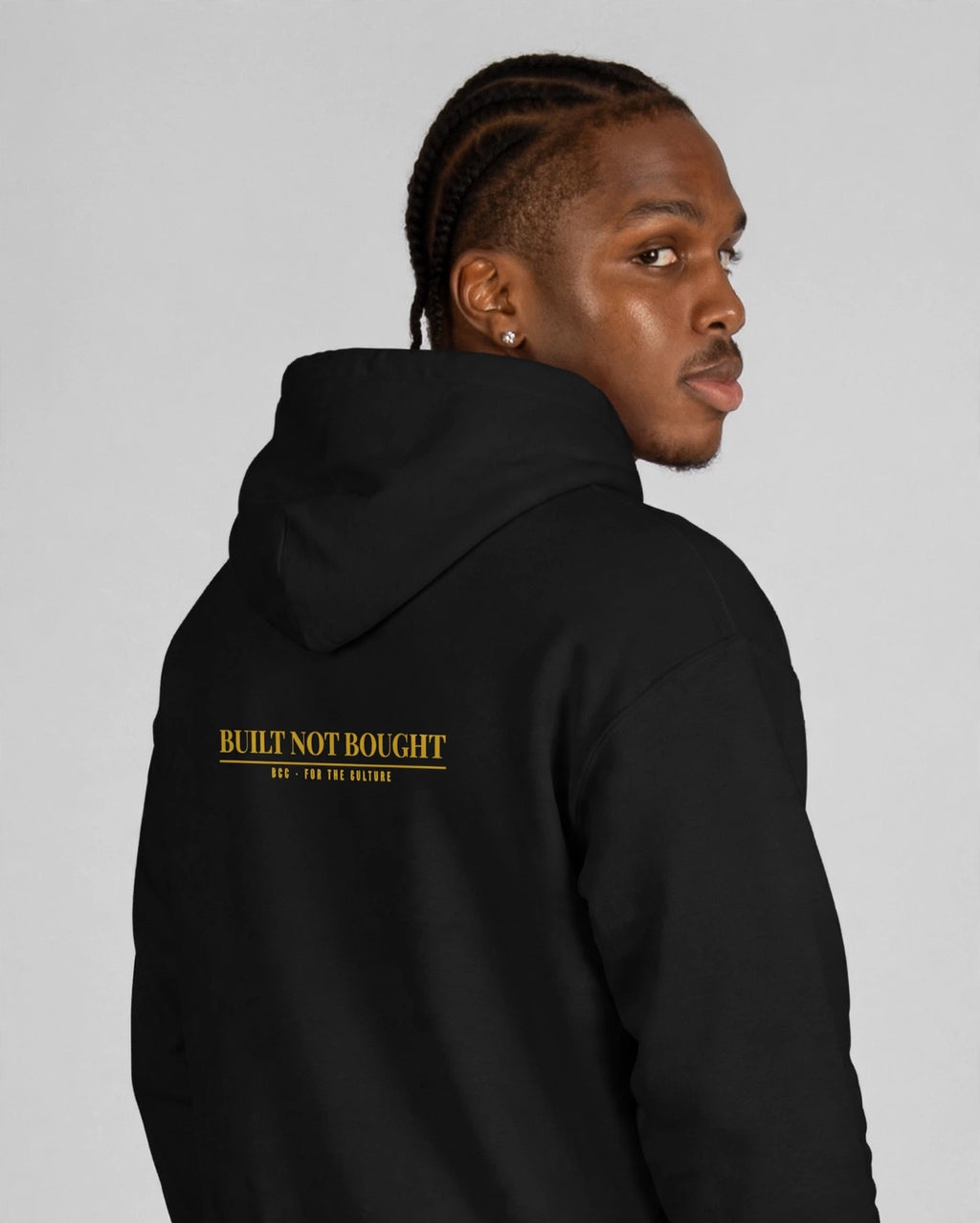 Patrick wearing the Built Not Bought Hoodie – Playfair (Black), back view