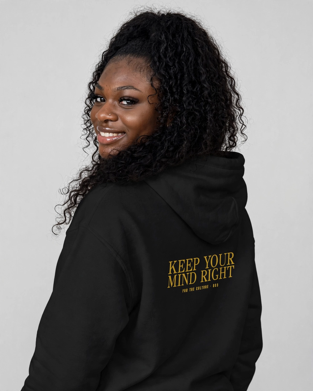 PA wearing the Keep Your Mind Right Hoodie – Didot (Black), back view