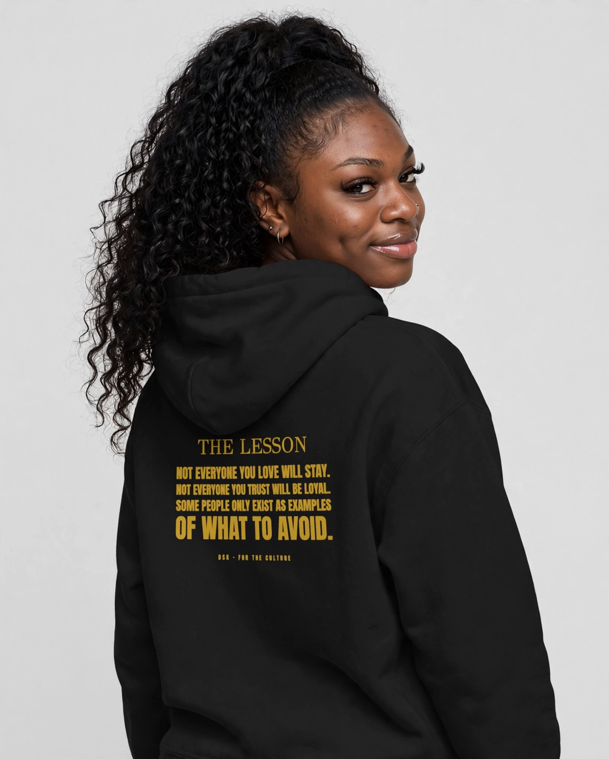 PA wearing the The Lesson Hoodie – Didot (Black), back view