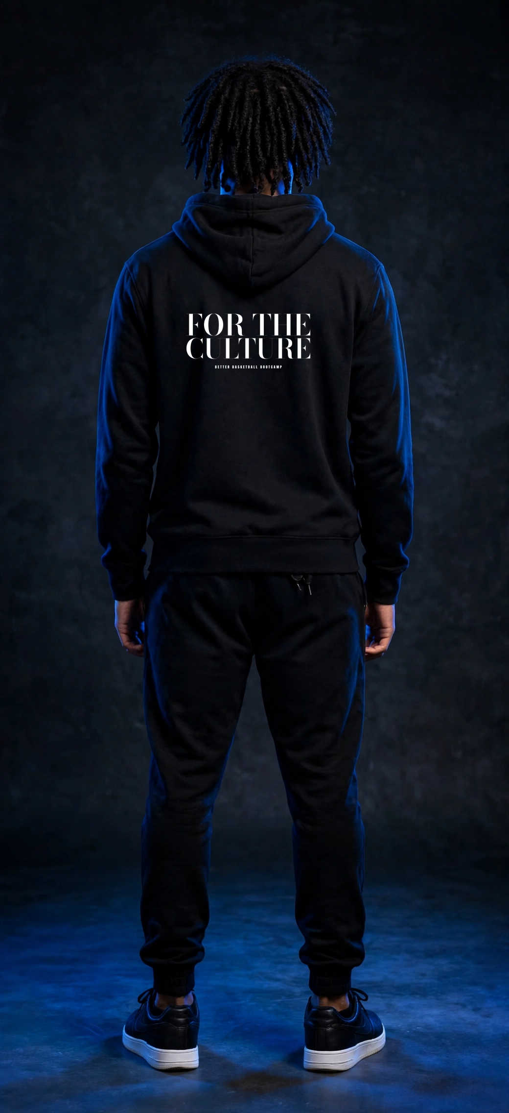 Sefi wearing the BBC Stadium Arch Hoodie – Black (back)